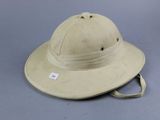 tan safari hat on grey background with a tag on the side of the hat