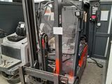 a forklift truck that is parked in a garage
