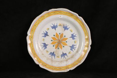 an image of a plate with yellow and blue designs on it