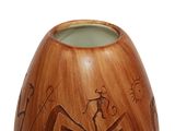 a wooden vase with a design on the inside of it