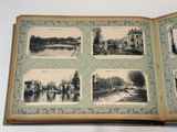 an open book with pictures of a river and a bridge