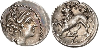 a silver coin with an image of a horse on it