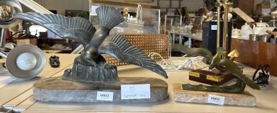 a statue of a bird that is on a table