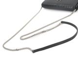 black leather purse with chain strap on white background