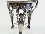 a silver table with a mirror on top of it