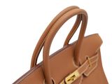 a close up of a brown handbag on a white background