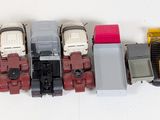 a lot of toy trains that are lined up on the table