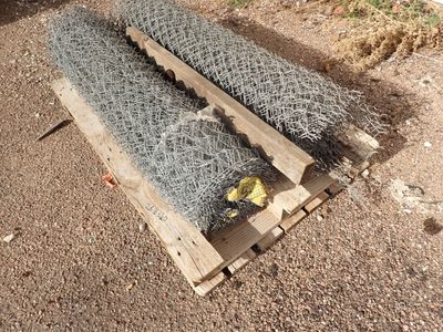 two pieces of gabios on a pallet on the ground