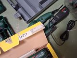 a box of tools sitting on a table next to a box of batteries