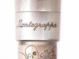 a close up of a metal object with writing on it