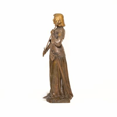 bronze statue of a woman holding an umbrella on a white background
