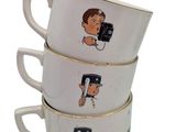 three white coffee cups with pictures of people on them stacked on top of each other