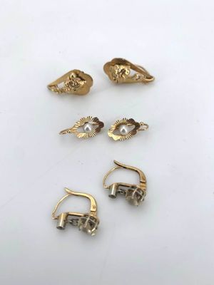 five pairs of gold earrings and a pair of earrings