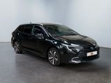 a black toyota auris hybrid parked in a white room