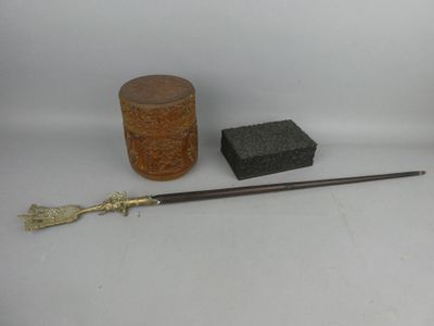 a small wooden box, a brush, and a box on a white surface