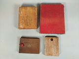 three pieces of wood are sitting on a table next to each other