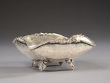 a silver bowl that is sitting on top of a table