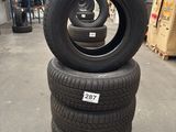 several tires stacked on pallets in a warehouse area