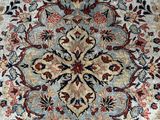 an oriental rug with a medallion design on the middle of it