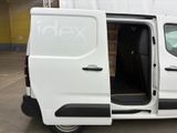 the white van is parked in the parking lot with its doors open