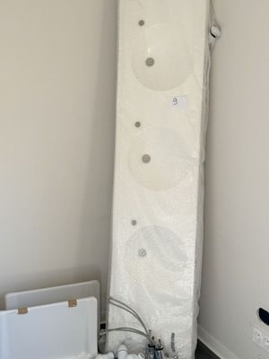 a picture of a room with a toilet and a mattress