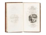 an open book with a picture of a man and a dog on it