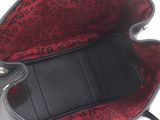an image of a black and red purse on a white background