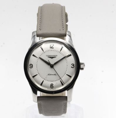 an image of a close up of a wrist watch on a white surface