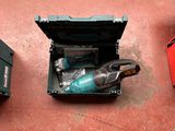 two tools that are sitting on the floor next to each other
