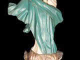 a statue of a woman holding a baby in her arms