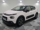 the white citrole is parked on a checkered floor