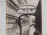 an old photo of a bridge over a river