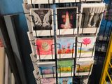 a display of greeting cards on a rack in a store