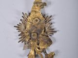 gold plated brooch with a crown on top of it