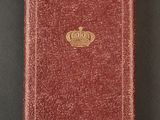 a red book with a gold crown on top of it