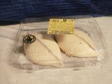 two pieces of cheese in a plastic container on a table