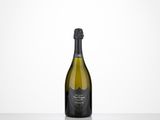 a bottle of champagne sitting on top of a table