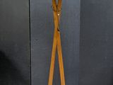 a lamp that is on a wooden stand in a room