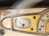 a close up of a car dashboard with a speedometer