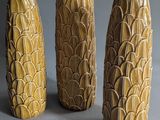 three vases that are sitting on a table