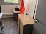 an image of a room with a desk, chair, and a window
