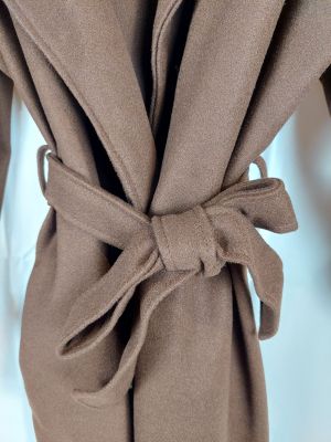 a close up of a coat with a tie on it