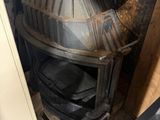 a pile of old metal items in the corner of a room