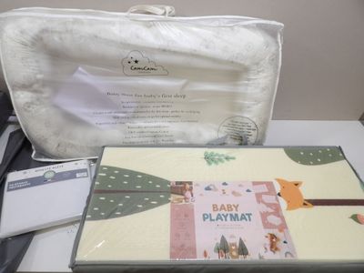 a baby play mat and a bag on a table