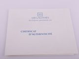 a close up of a white book with blue writing on it