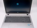 a laptop that is sitting on a white table