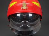 a close up of a fireman ' s helmet and goggles on a black background