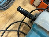 an image of a close up of a drill on a table