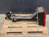 a large pipe sitting on a pallet with a hose attached to it