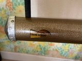 a close up of a tube with a sticker on it